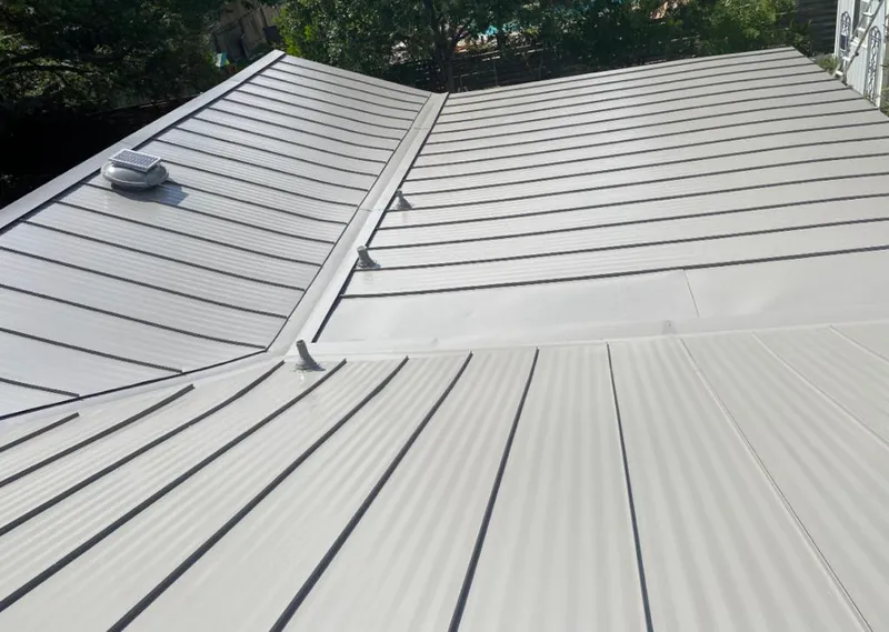 Solar attic fan installed on a metal roof for Roof Ventilation in Cottonwood